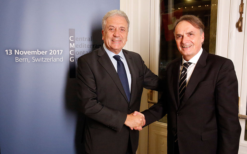 Dimitris Avramopoulos, European Commissioner for Migration, Home Affairs and Citizenship, left, and Mario Gattiker, State Secretary for Migration, right, shake hands during the 3rd meeting of the Central Mediterranean Contact Group, in Bern, Switzerland, 12 November 2017